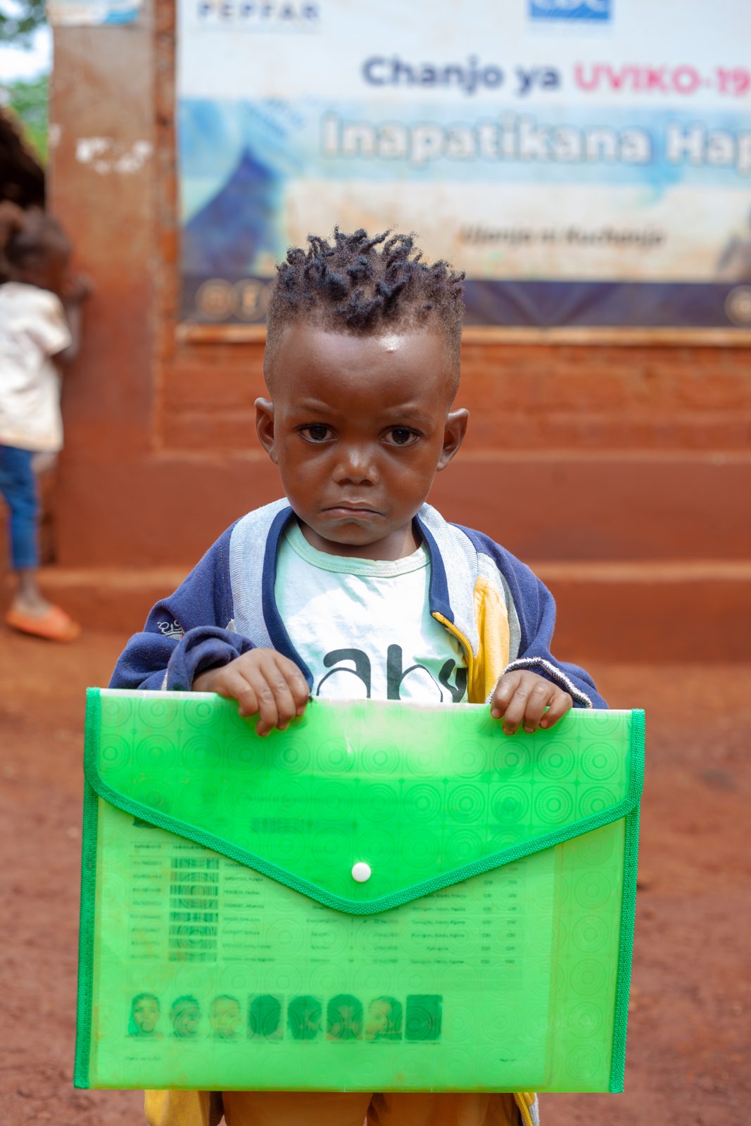 A child at an OwosTanzania community health outreach event in Tanzania