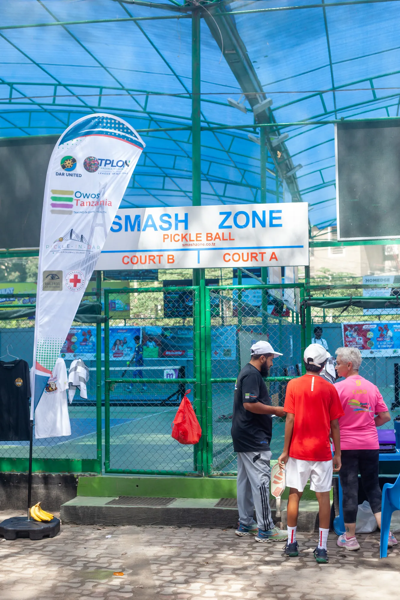 Smash Zone venue entrance with the Dar United sponsor banner